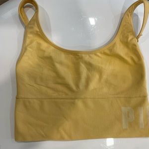 Yellow Sports bra. Color / yellow . Company pink size small.